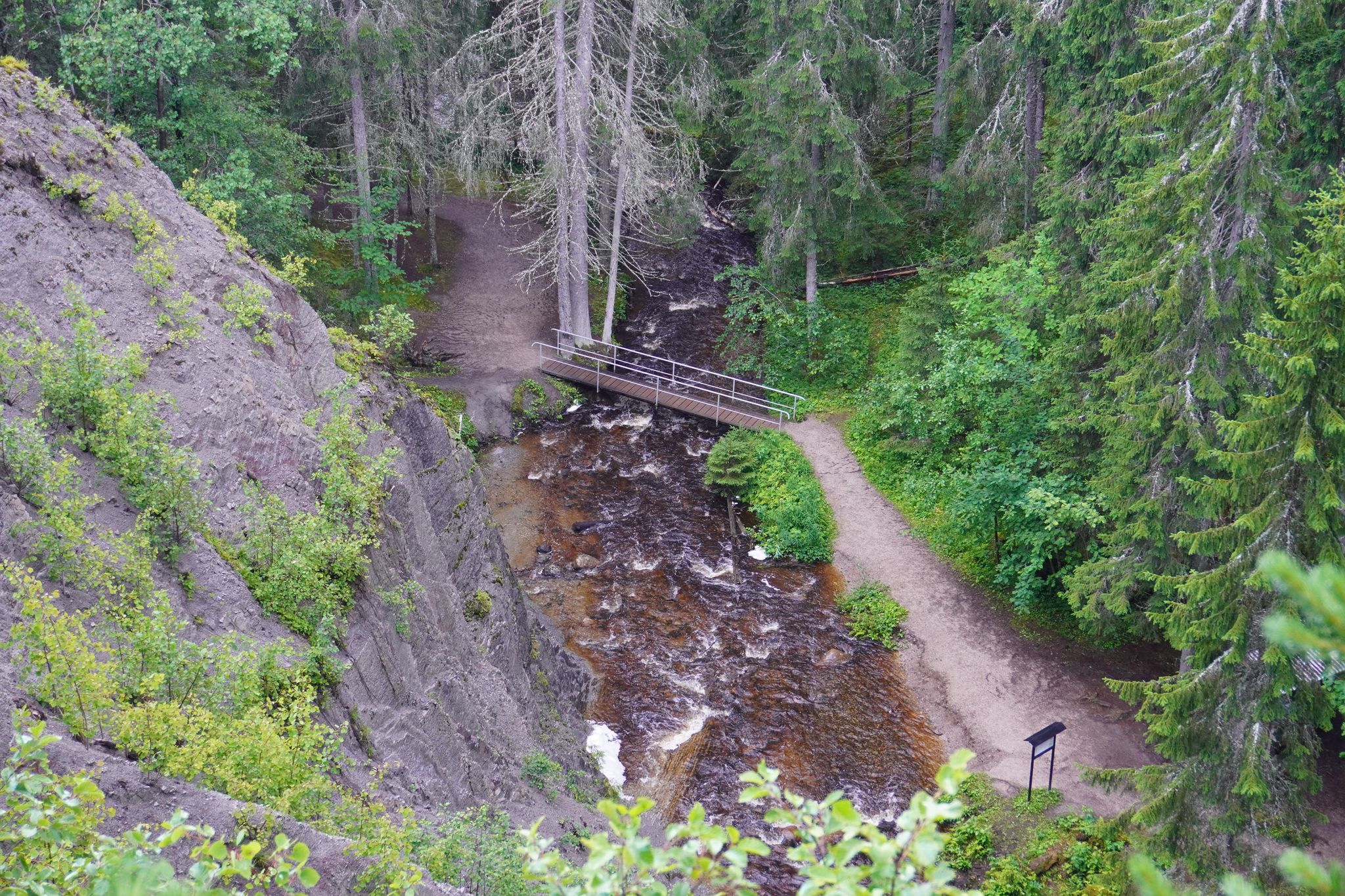 photo of the surroundings in the forest near the Styggforsen waterfall in Dalarna, Sweden.
