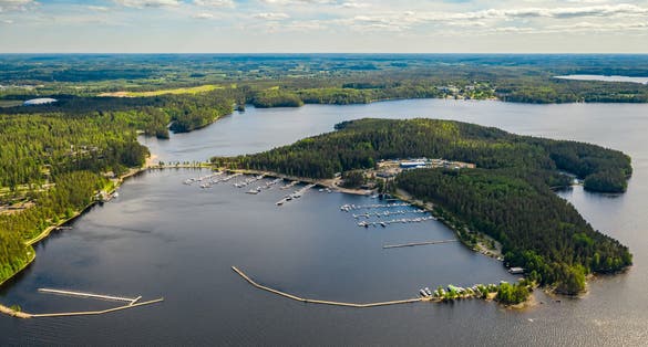 Photo of aerial view of beautiful landscape of lakes and forest in Imatra, Finland.