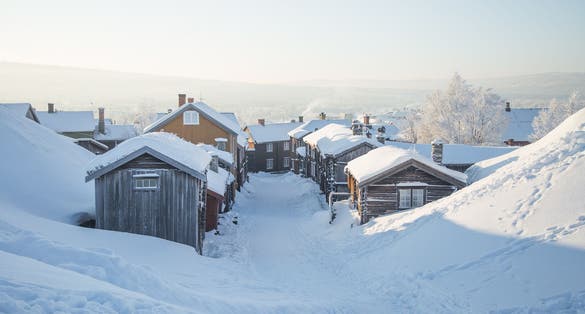 photo of view of A beautiful morning sceney of a small Norwegian town Roros in winter. World heritage site. Scandinavian winter landscape.