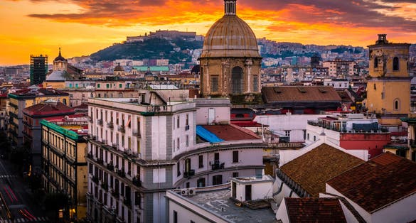 Photo of Stunning rooftop view of Naples from above during sunset.