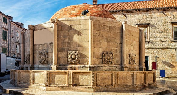 Photo of large Onofrio Fountain on the Square at Stradun Street in the Old city of Dubrovnik, Croatia.