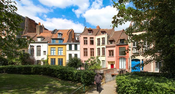 Photo of Row of old colorful houses in Place Gilleson behind Notre-Dame de la Treille Cathedral in Lille, France.