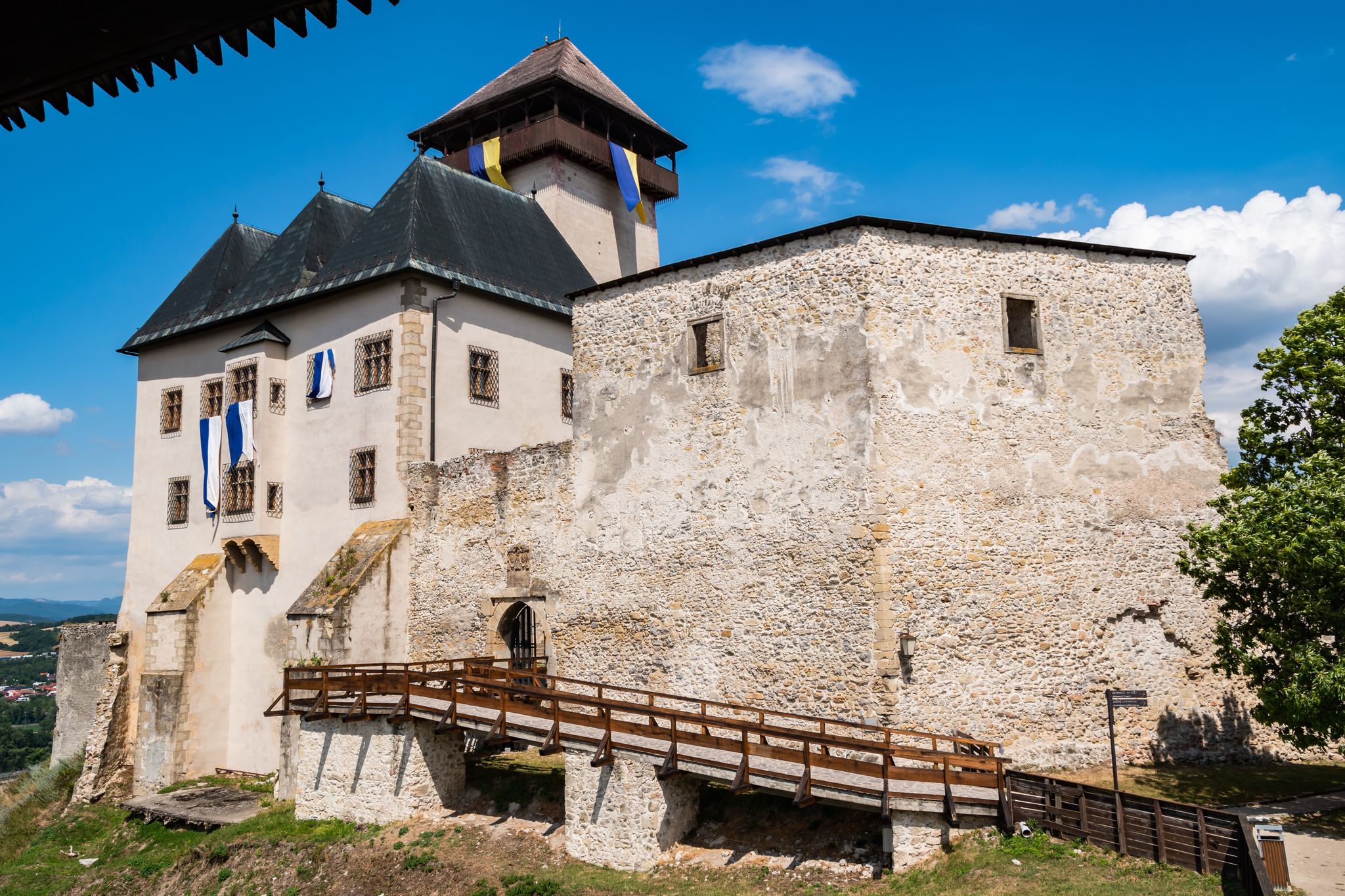 Beautiful view of the Trenčín castle (Trenčiansky hrad) on a hill above the city on a sunny day, Trencin Region (Trenčiansky kraj)