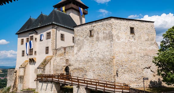 Beautiful view of the Trenčín castle (Trenčiansky hrad) on a hill above the city on a sunny day, Trencin Region (Trenčiansky kraj)