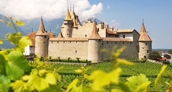 photo of Aigle Castle in beautiful sunny day in Aigle, Switzerland.