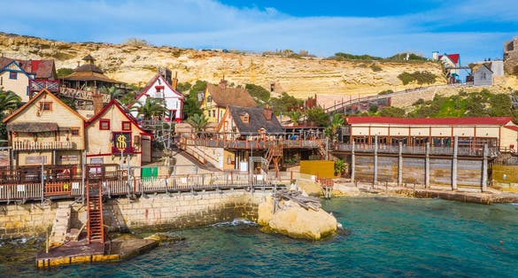 Photo of aerial view of famous Popeye village on a sunny day, Mellieha , Malta.