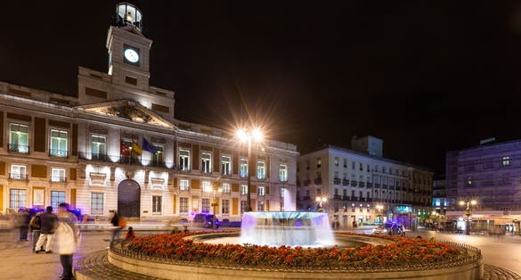 Photo of Night street of Madrid. Post Office at Puerta del Sol .