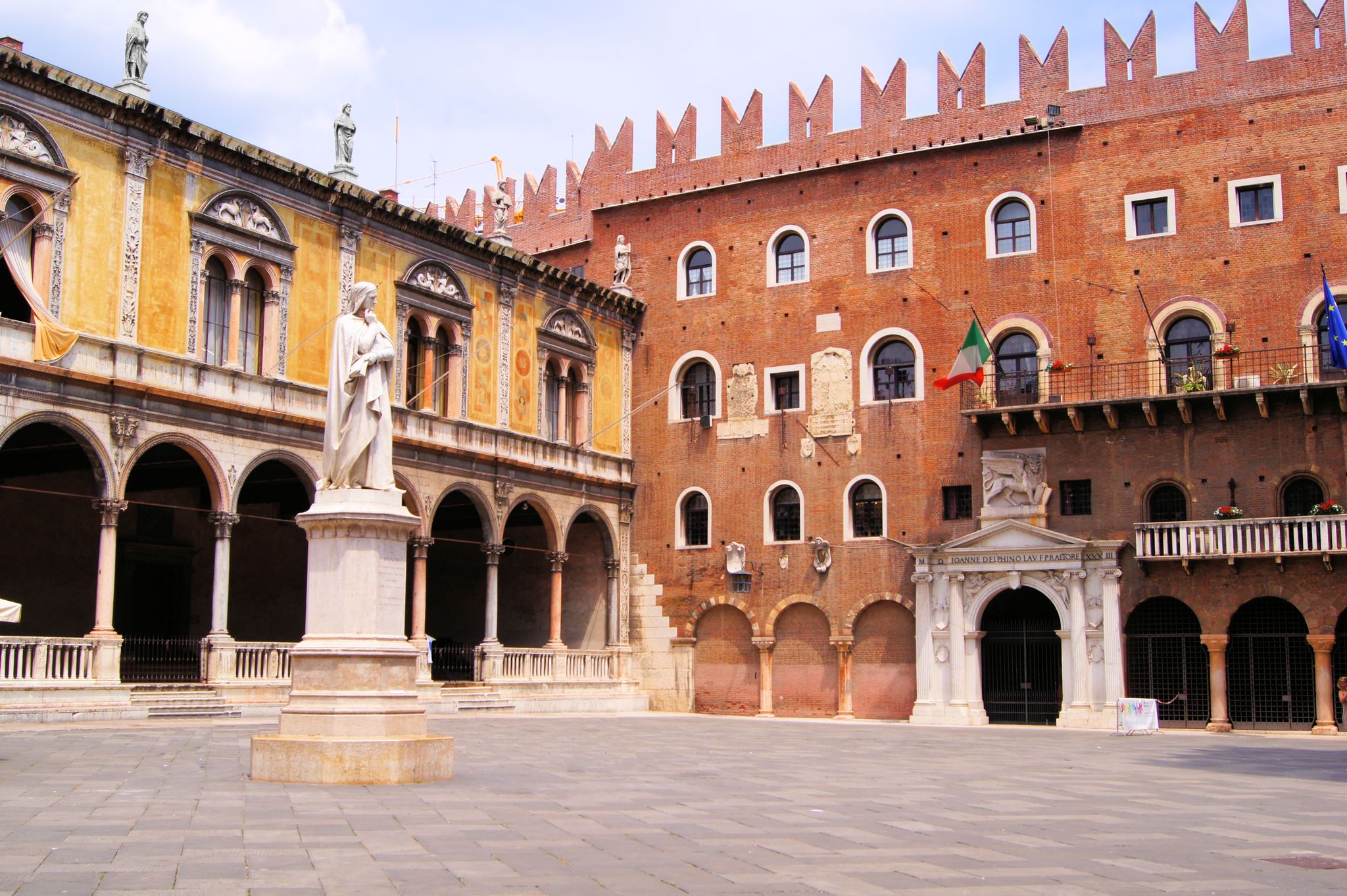 photo of Verona, Italy - Piazza dei Signori with Dante statue .
