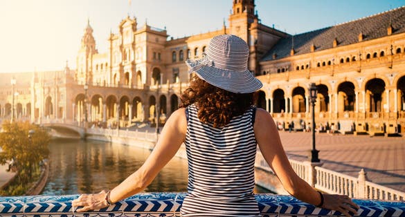 Photo of woman admiring Plaza de Espana (Spain Square), Seville.