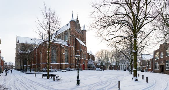 photo of winter cityscape panorama of the Pieterskerk church (1121) in Leiden, the Netherlands.
