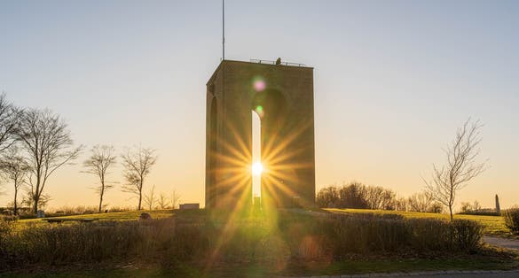 Photo of Danish landmark Ejer Bavnehill on a sunset evening, Denmark.