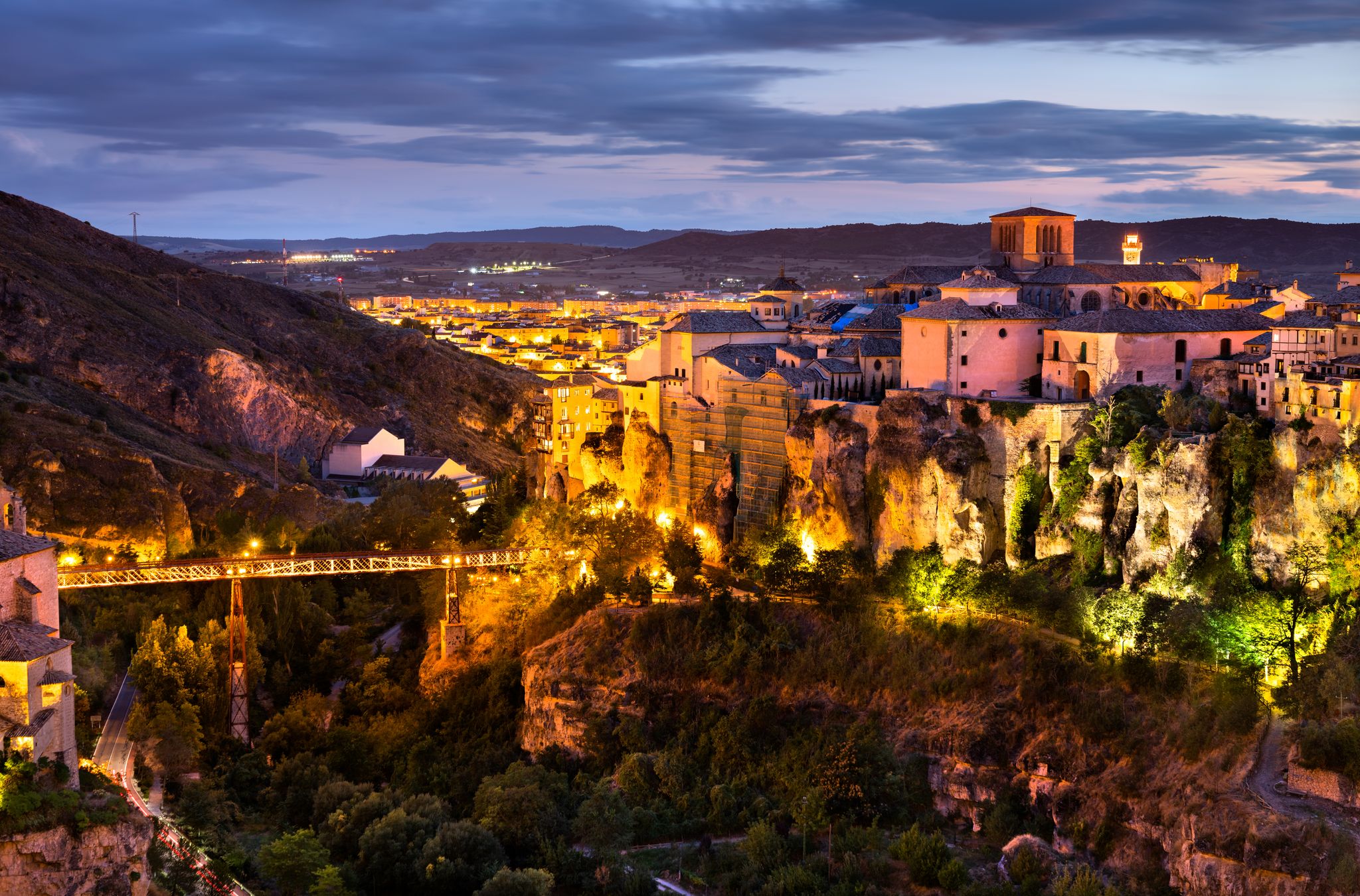 photo of night view of Cuenca Cathedral and San Pablo Bridge in Spain.