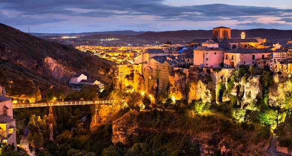photo of night view of Cuenca Cathedral and San Pablo Bridge in Spain.