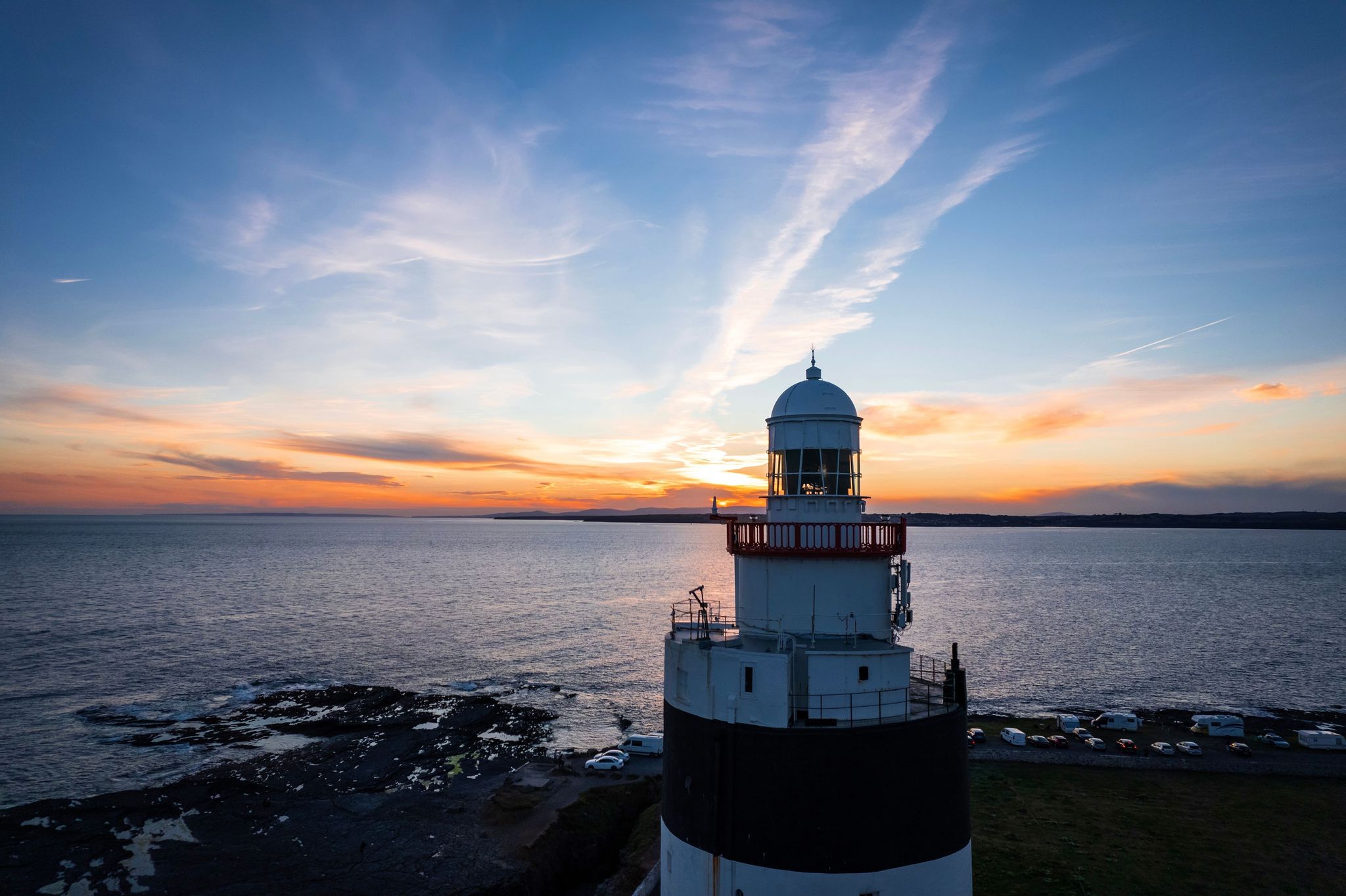 Photo of aerial view of Hook Lighthouse is a building on Hook Head at the tip of the Hook Peninsula in County Wexford, Ireland.