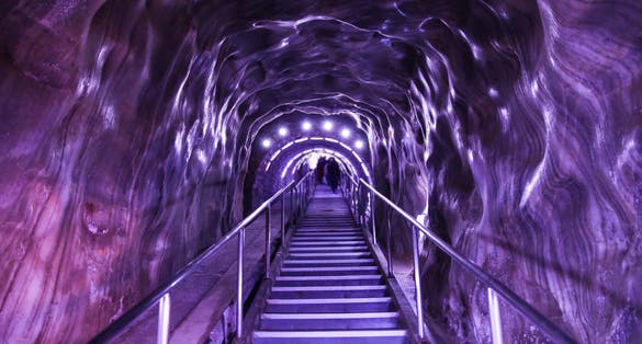 Photo of Illuminated underground entrance of Turda salt mine, Cluj, Romania.