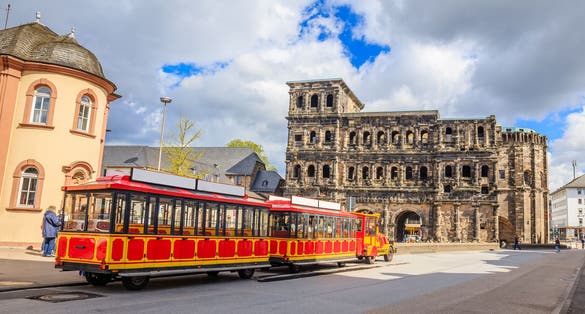 photo of view of Porta Nigra with sightseeing road train - Trier, Germany,Trier  germany.