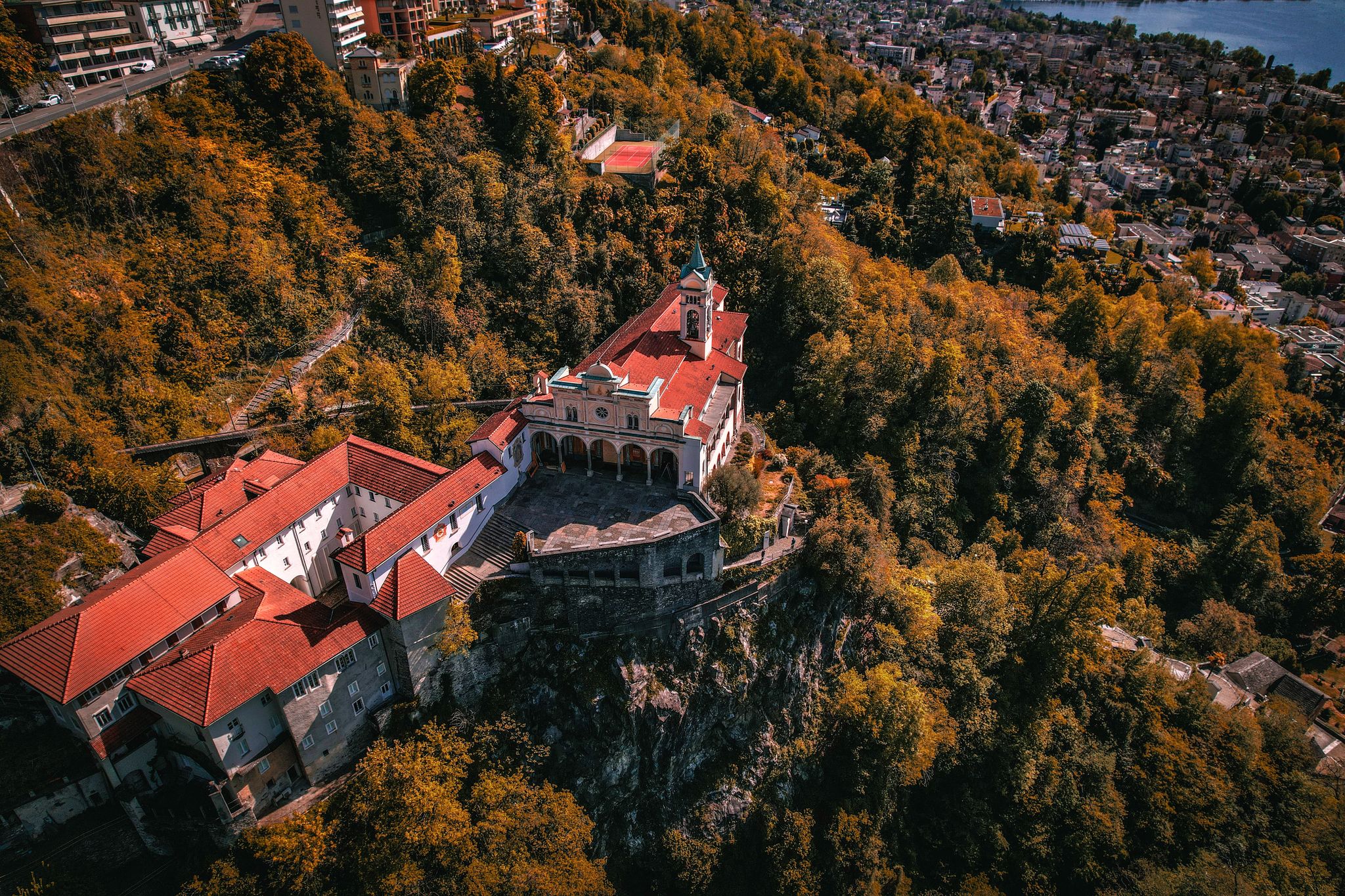 photo of aerial view of Madonna del Sasso, Switzerland. The Madonna del Sasso is a sanctuary and pilgrimage church in Orselina, above the city of Locarno in Switzerland.
