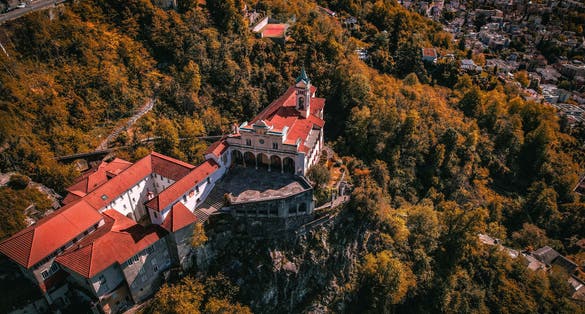 photo of aerial view of Madonna del Sasso, Switzerland. The Madonna del Sasso is a sanctuary and pilgrimage church in Orselina, above the city of Locarno in Switzerland.