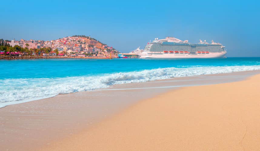Photo of panoramic beach landscape, The cruise ship is located on Kusadasi Island in the port of Kusadasi, Turkey.