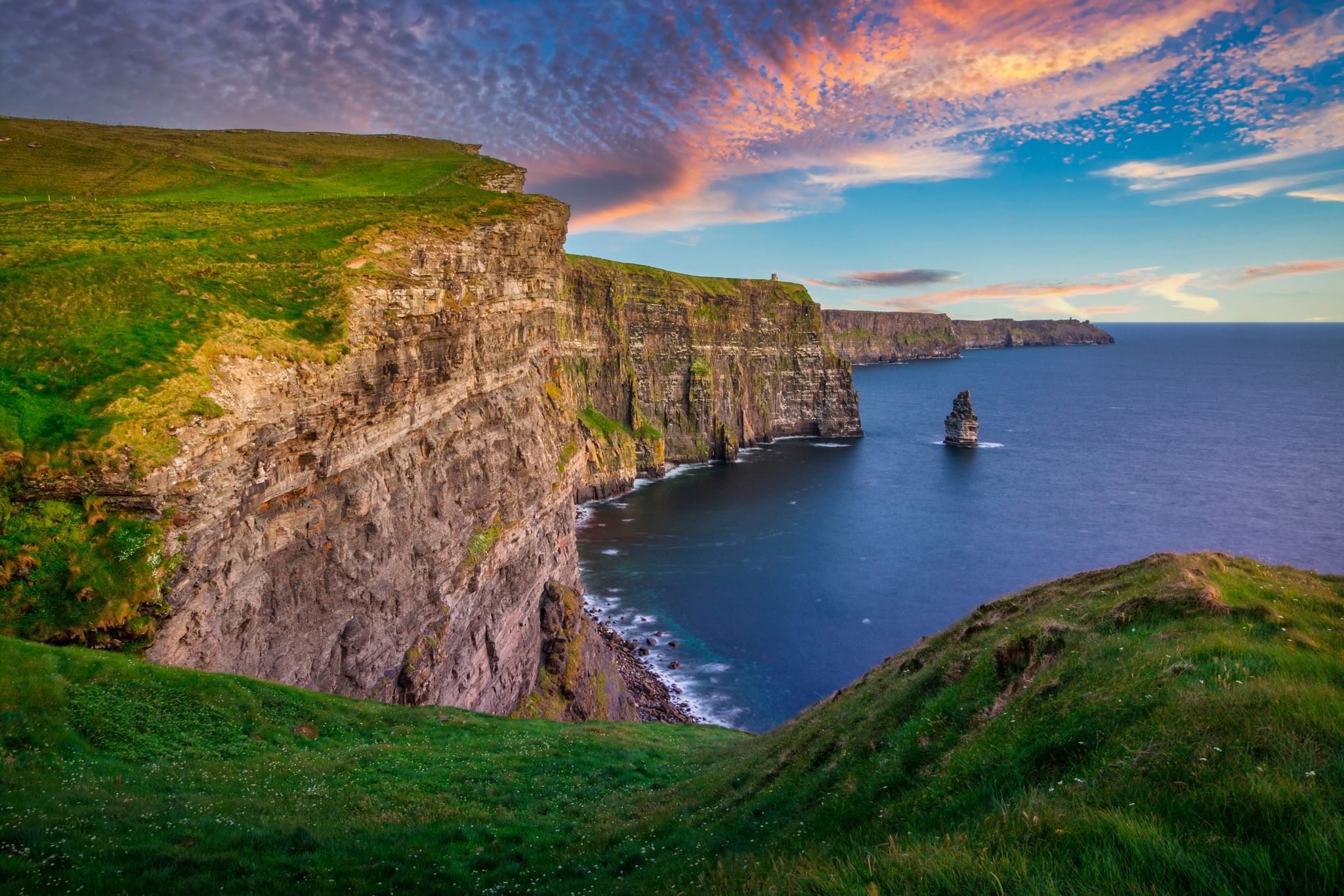 Photo of amazing Cliffs of Moher at sunset in Ireland, County Clare.