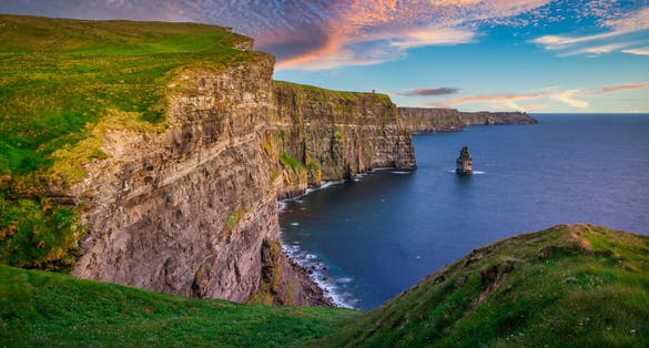 Photo of amazing Cliffs of Moher at sunset in Ireland, County Clare.