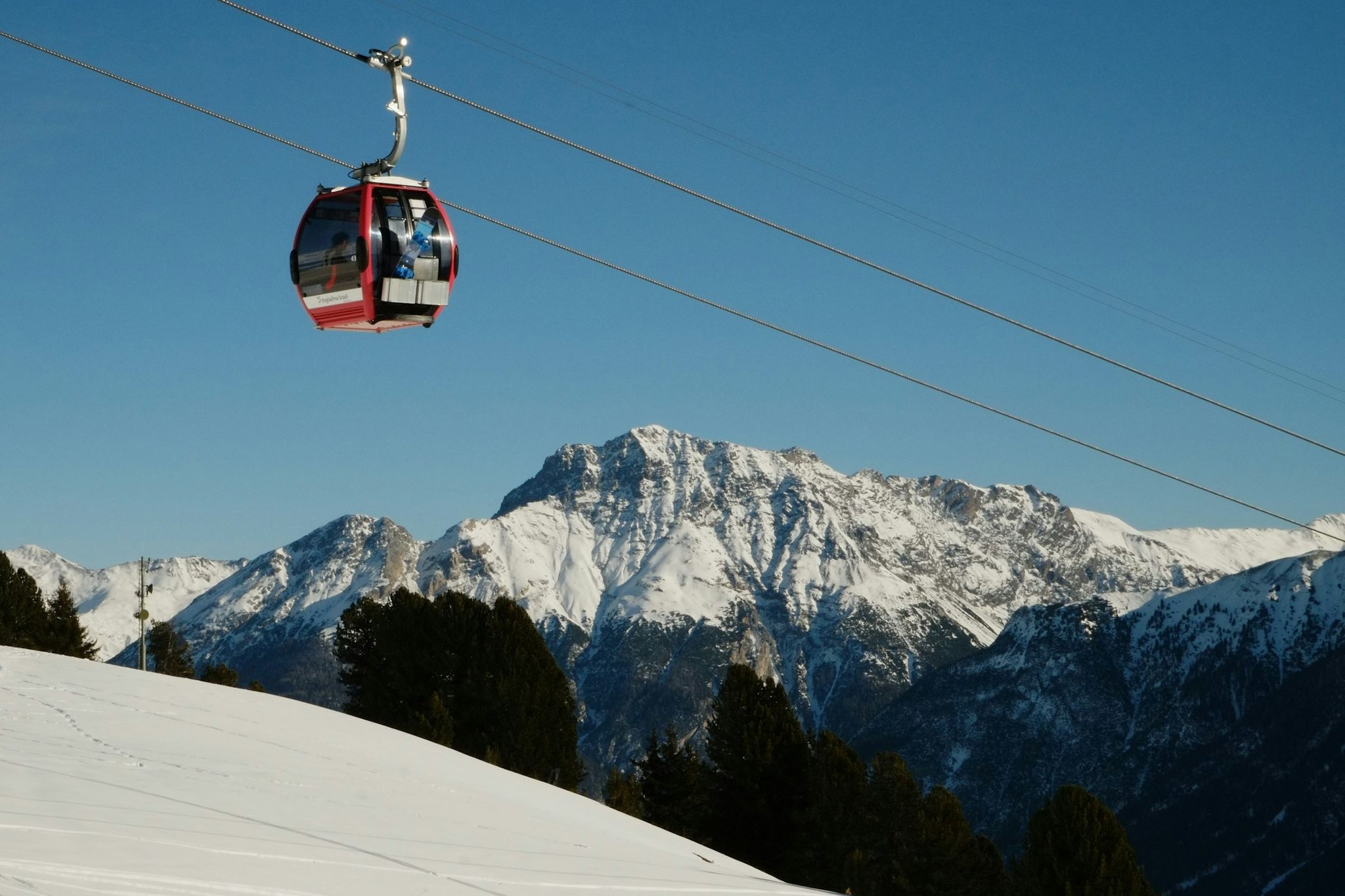 Photo of  beautiful Scuol town in Swiss Alps and Inn river, Switzerland.