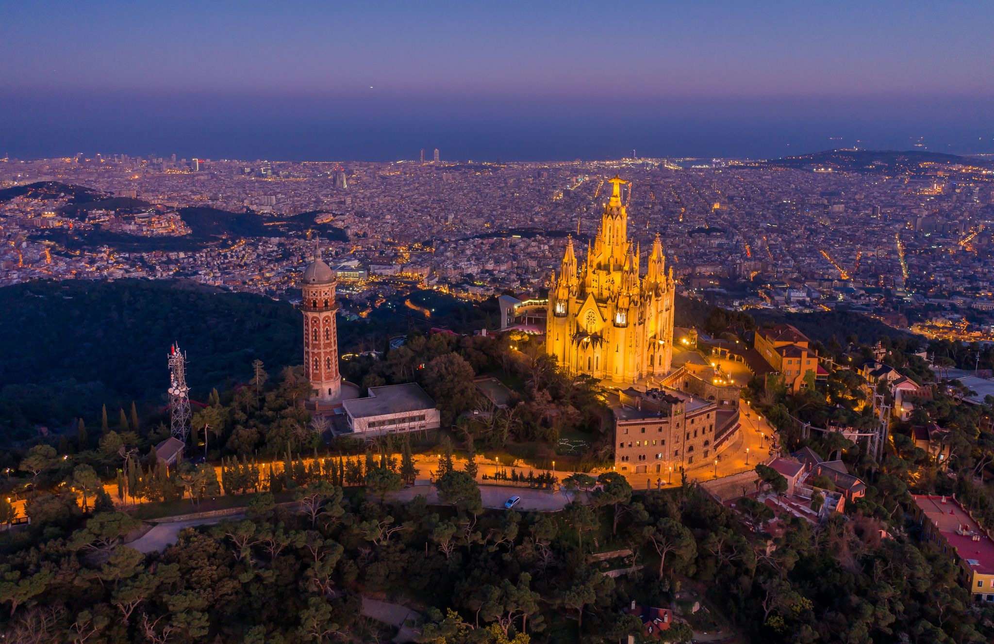 Photo of Aerial view of Barcelona skyline with Sagrat Cor temple at night, Catalonia, Spain .