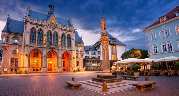 photo of view of Erfurt, Germany. Cityscape image of old town Erfurt, Thuringia, Germany with the neo-Gothic Town Hall on Fischmarkt square at sunrise.
