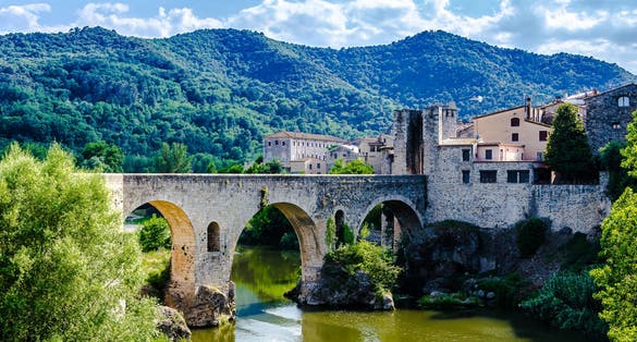 Photo of famous medieval bridge over the river Fluvia in the medieval village de Besalú, Girona, Catalonia, Spain.