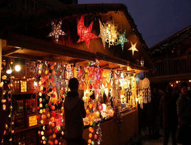 Colorful lanterns and handcrafted decorations at a Christmas market stall in Switzerland..jpg