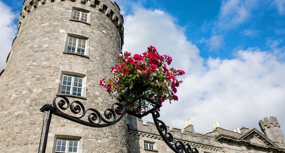 photo off view of Kilkenny Castle, Ireland. Caislean Chill Chainnig. A castle in Kilkenny, Ireland built in 1195 to control a fording-point of the River Nore