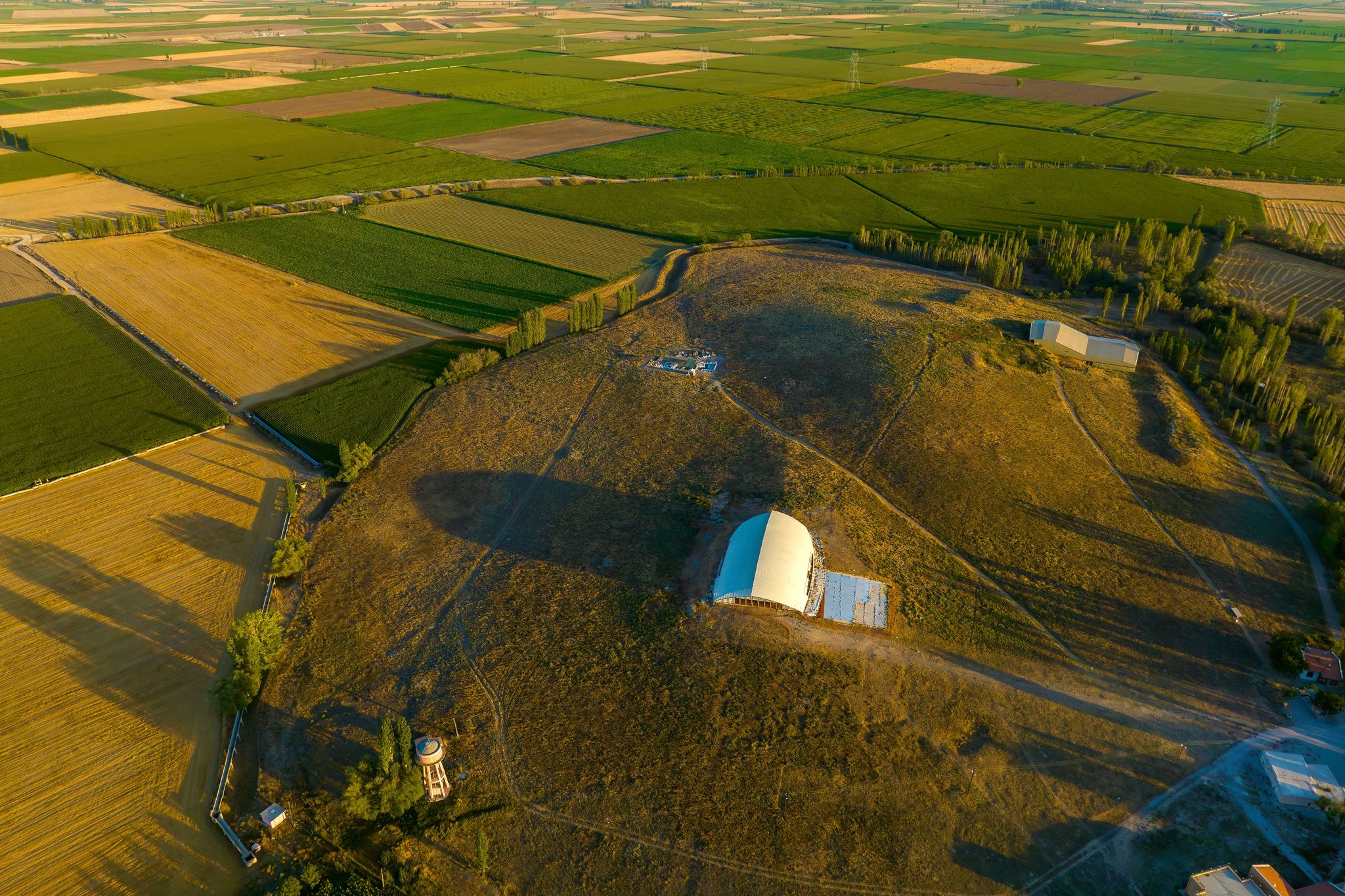 photo of aerial view of Catalhoyuk is oldest town in world with large Neolithic and Chalcolithic best preserved city settlement in Cumra, Konya, Turkey.