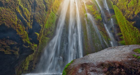  photo of Gljufrabui, secret waterfall hidden in a cave, iceland scenery.