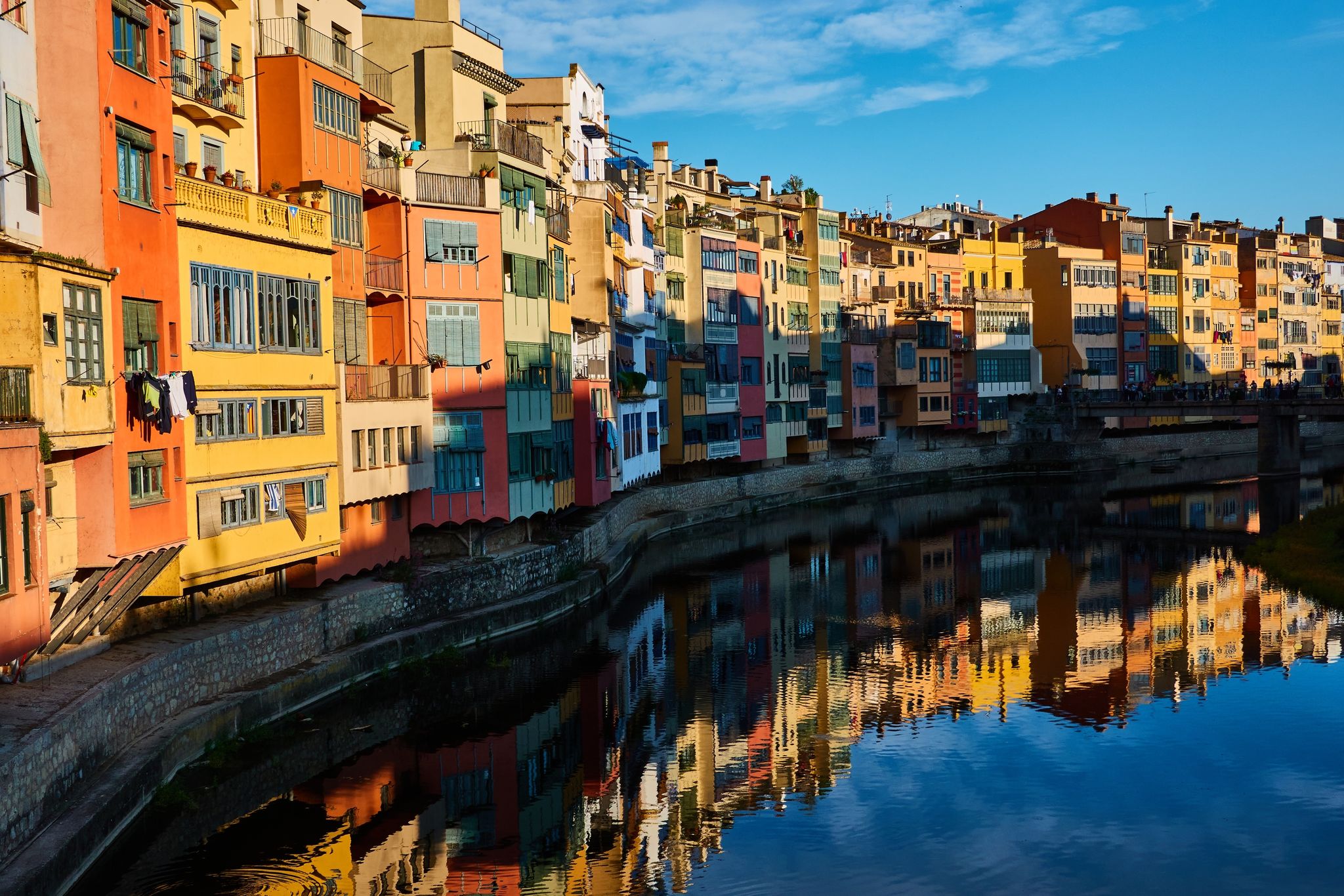 photo of the colored houses on the banks of the River Ter, called Casas del Onyar, in Girona. Catalonia. Spain.
