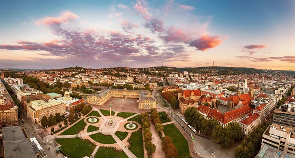 Photo of aerial panoramic view of the famous Schlossplatz in Downtown Stuttgart, Germany at sunset.