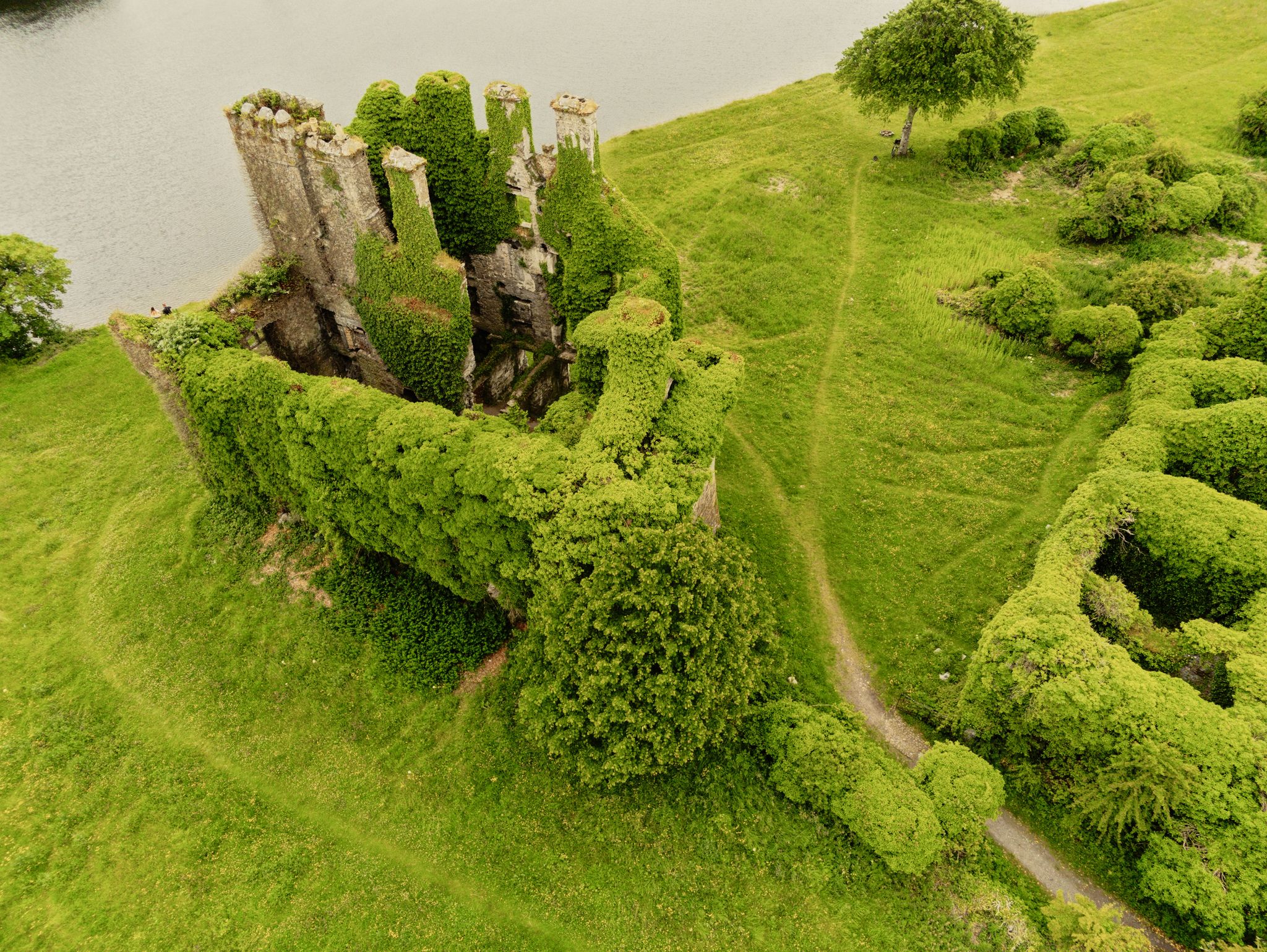 photo of Aerial drone view on Menlo castle, Galway city, Ireland. Historic building on River Corrib shore. 