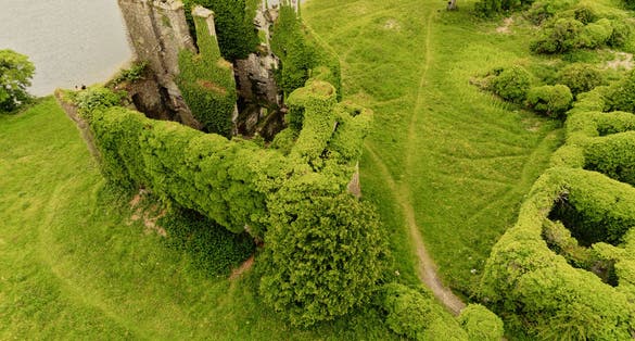 photo of Aerial drone view on Menlo castle, Galway city, Ireland. Historic building on River Corrib shore. 