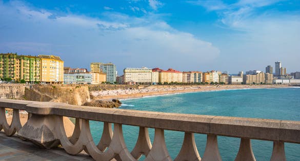 Photo of panoramic view of Orzan beach and the city of La Coruna, in the Galicia region of Spain.