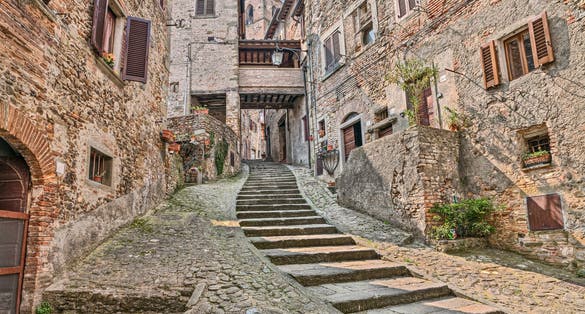 photo of view of Anghiari, Arezzo, Tuscany, Italy: picturesque old narrow alley with staircase in the medieval village, Arezzo, Italy.