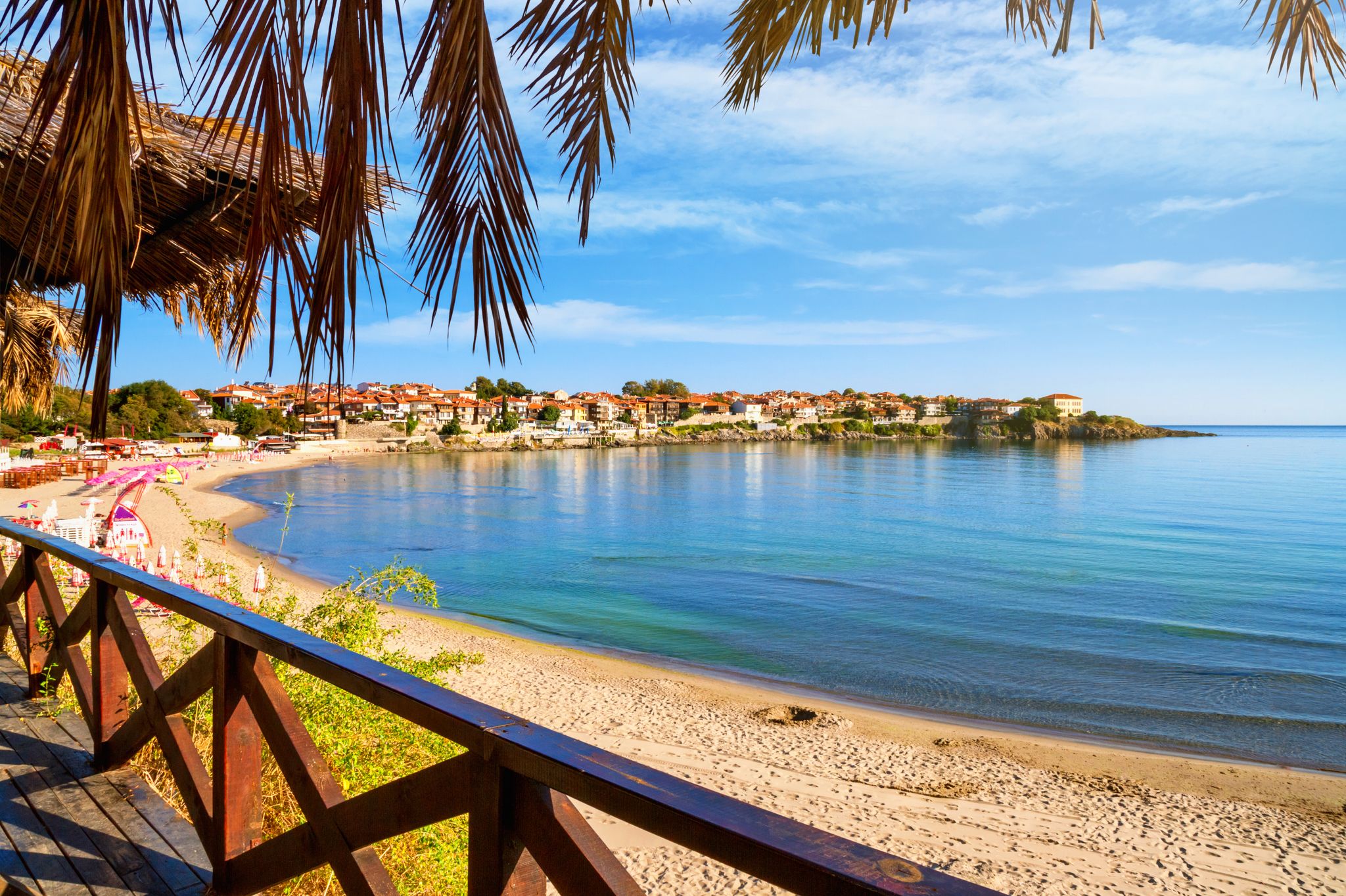 Photo of view from the cafe to the sandy beach with umbrellas and sun loungers in the town of Sozopol on the Black Sea coast in Bulgariaview from the cafe to the sandy beach with umbrellas and sun loungers in the town of Sozopol on the Black Sea coast in Bulgaria.