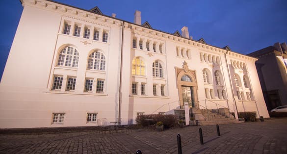 photo of cityscape by dusk in Reijkiavik on March 19, 2018 national museum of Iceland by dusk.