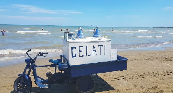 Selling ice cream on the beach, Barletta, Italy, Puglia
