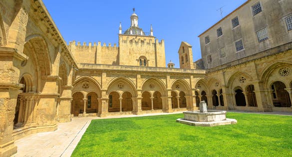 Gothic romanesque cloister of old Coimbra Cathedral and dome. Se Velha de Coimbra, is one of most important romanesque buildings in Portugal and landmark in Coimbra, north of Portugal.