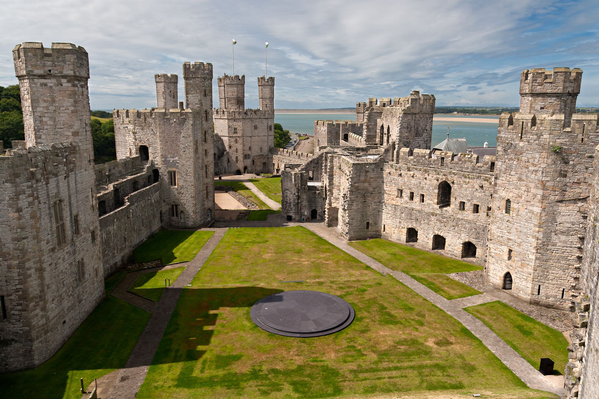 Photo of Caernarfon Castle, a medieval fortress in Caernarfon, Gwynedd, north-west Wales.