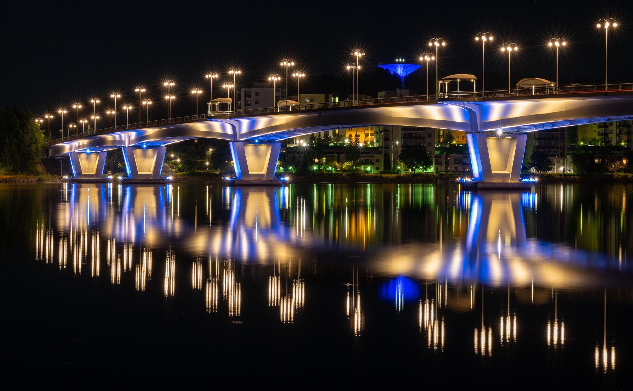 Photo of Kuokkala Bridge in night over the lake Jyvasjarvi in Jyvaskyla, Finland.