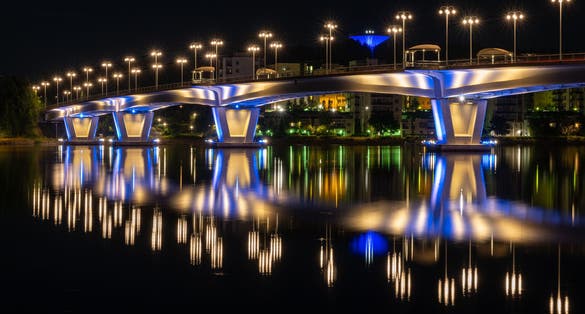 Photo of Kuokkala Bridge in night over the lake Jyvasjarvi in Jyvaskyla, Finland.