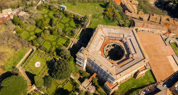 Aerial view of Villa Farnese and its gardens located in Caprarola, near Viterbo, Italy. It is a pentagonal palace in the Renaissance and Mannerist style. The building is empty.