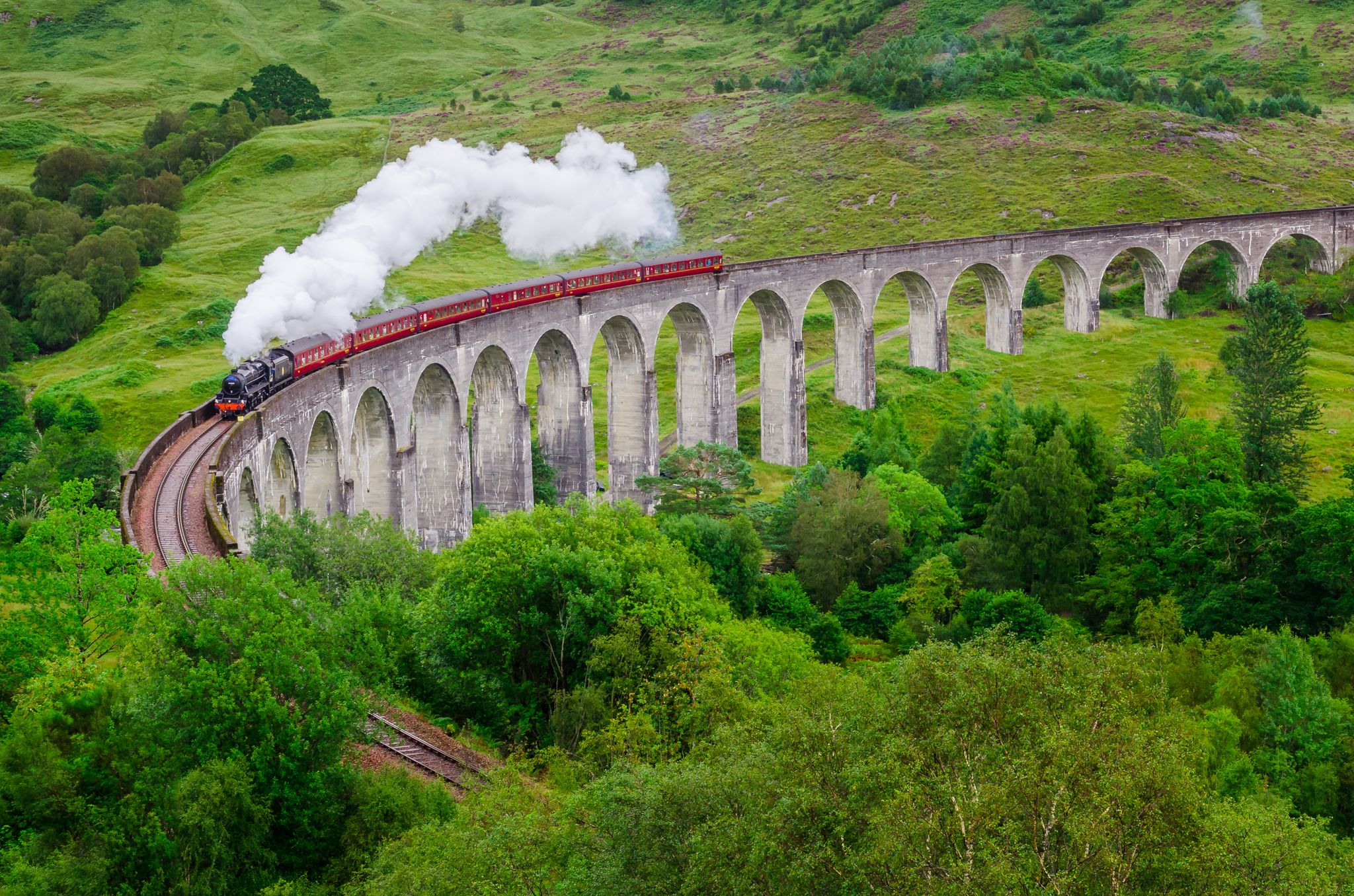 Photo of Detail of steam train on famous Glenfinnan viaduct, Scotland, United Kingdom .