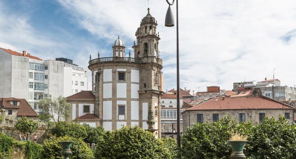 Photo of side view of the Church of the Pilgrim Virgin in Pontevedra, from the gardens of the Convent of San Francisco, Galicia, Spain.