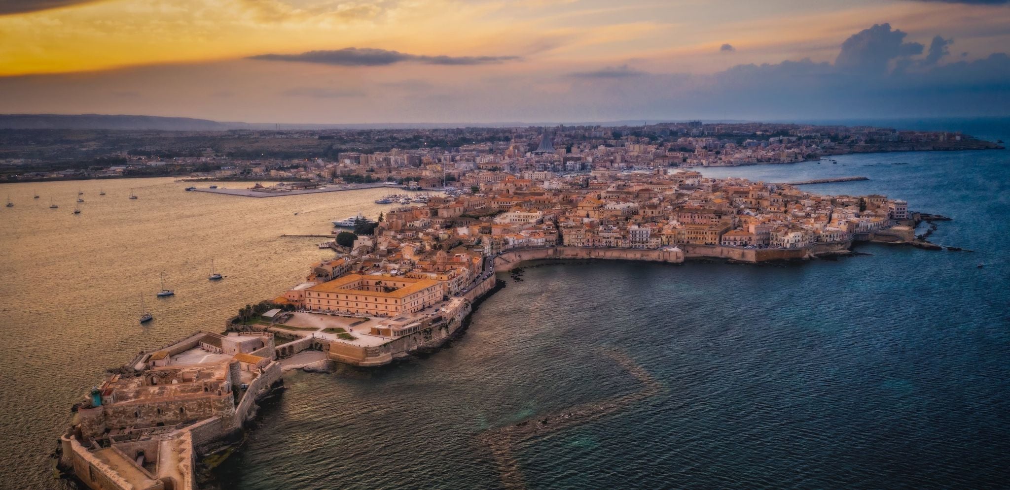 Aerial sunset view of Ortigia Island in Sicily during early summer in Italy in June..jpg